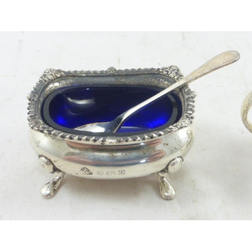 39 - Two Birmingham Hallmarked Silver Glass Lined Condiment Pots complete with Spoons (A/F) (85 grams)