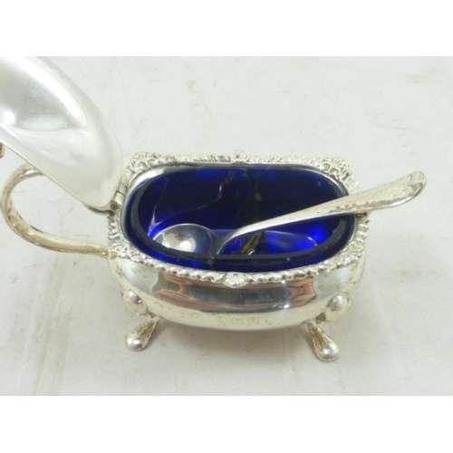 39 - Two Birmingham Hallmarked Silver Glass Lined Condiment Pots complete with Spoons (A/F) (85 grams)