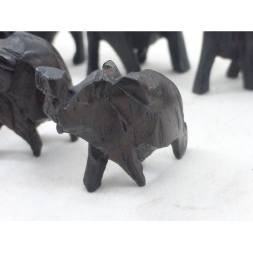 76 - Collection of Twelve Hand Carved Ebony African Elephants in Various Sizes