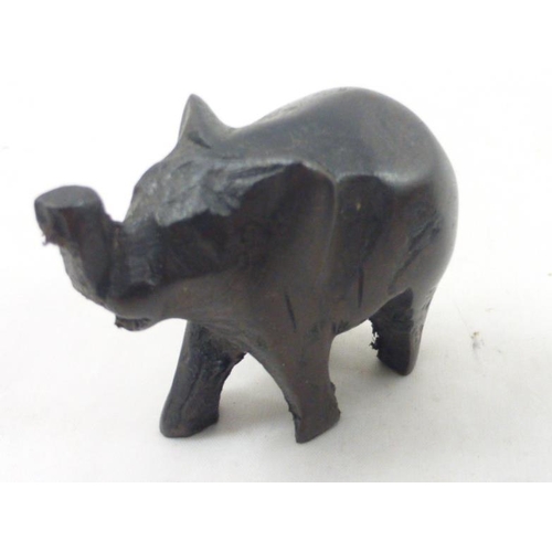 76 - Collection of Twelve Hand Carved Ebony African Elephants in Various Sizes