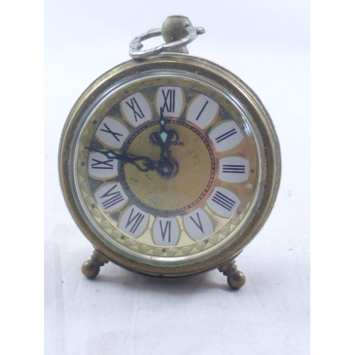 27 - Marksman Decorated Gilt Travel Clock