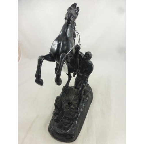 41 - Hollow cast figure of man with horse approx. 40cm