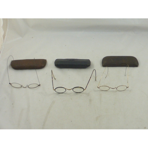 74 - Three Pairs of vintage spectacles complete with cases