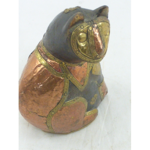 10 - Hand carved cat figure decorated with brass and copper