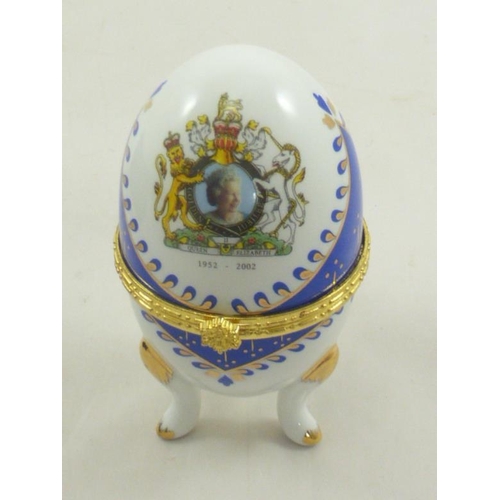 119 - Three commemorative porcelain eggs