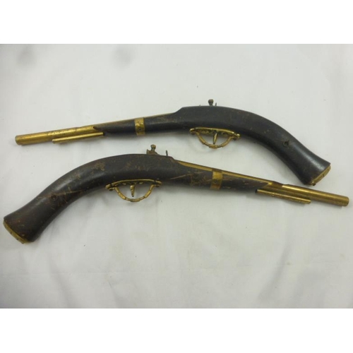 210 - Two Wood and Brass Ornamental Wall Mounted Muskets