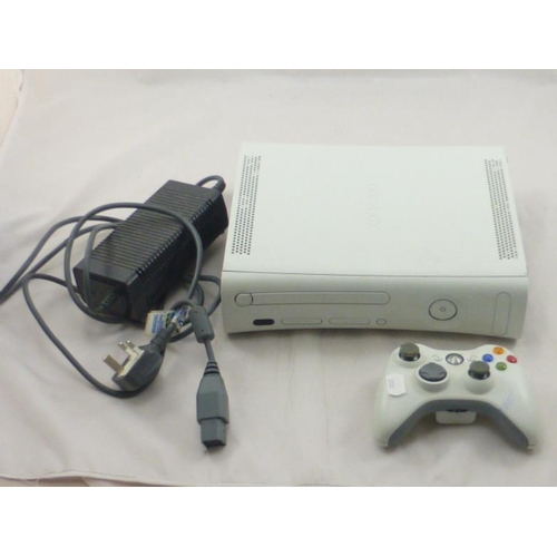 80 - Xbox 360 complete with controller, powers on