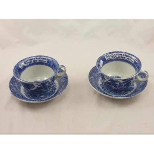 262 - Two Burslem Blue and White Moto Cups and Saucers