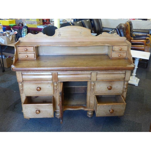 102 - Antique pine kitchen dresser complete with cupboard and eleven drawers