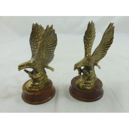 398 - A Pair of Brass Eagles mounted on wooden plinths