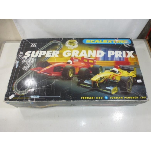 604 - Super Grand prix Scalextric with cars and My First Scalextric with minis both appear complete