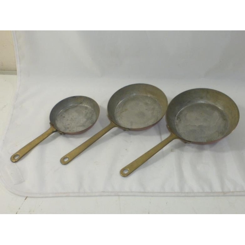 155 - Set of Three Graduated Copper and Brass Handled Pans