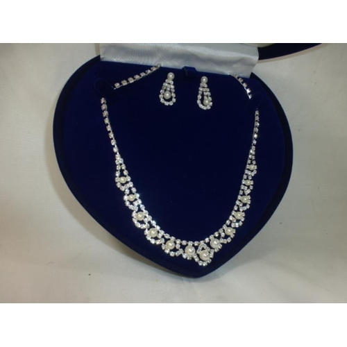 50 - Ladies costume dress set to include Pearl and Diamante effect necklace and earring set in presentati... 