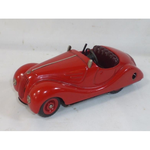 158 - Schuco Akustico 2002 car, red tinplate body, Burgundy interior with lithographed detailed dashboard,... 