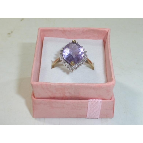 172 - Hallmarked Birmingham 375 Gold Ring with Large Amethyst center Stone Surrounded by Diamond (Size T)