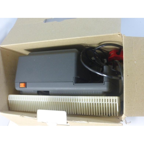 359 - Novamat Slide Projector in box complete with Selection of Slides