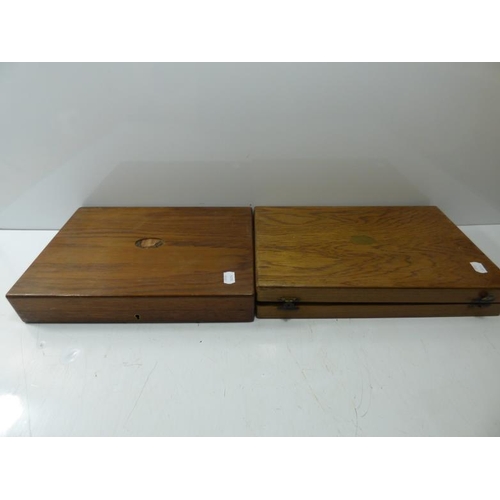 106 - Two wooden cutlery boxes to include some cutlery