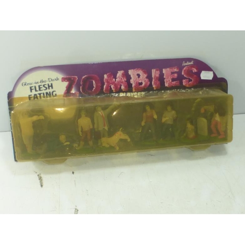 248 - Accoutrements Glow In The Dark Flesh Eating Zombies Play Set