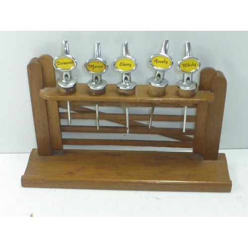 12 - Selection of Spirit Pourers Mounted in Gate Display
