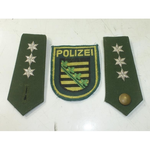 239 - East German Policemans Epaulettes and Badge