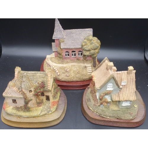 98 - Three Boxed Hand Painted Resin Lighted Cottages