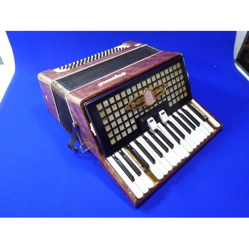 123 - Russian Accordion Complete with Case- (no damage to bellows)