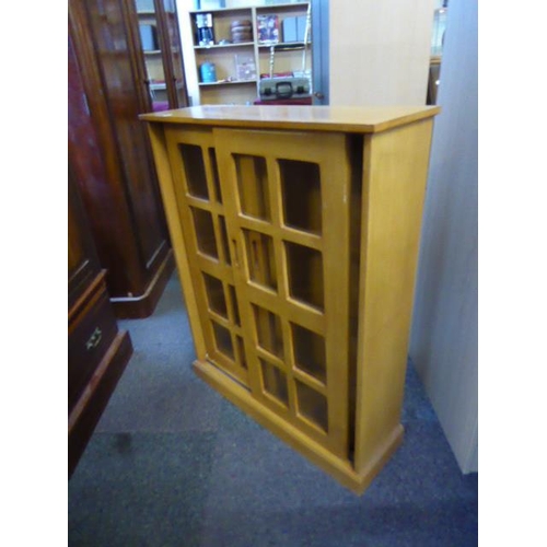 468 - Small book case with sliding glass fronted doors and cube design