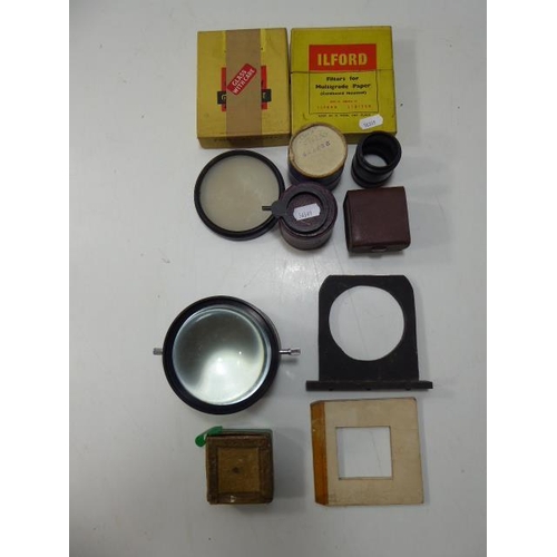 83 - Vintage of camera items to include lenses , filters and other