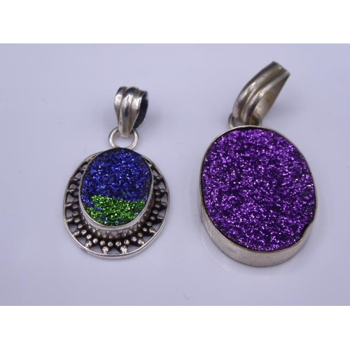 307 - Two Glitter stoned silver pendants
