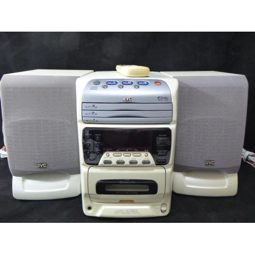 695 - A JVC Milti CD Stereo System with Radio and Cassette Player. Comes with Speakers and Remote