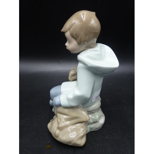 282 - NAO By Lladro Figurine Boy with bunny Resting On Excursion #1037