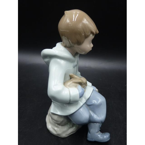 282 - NAO By Lladro Figurine Boy with bunny Resting On Excursion #1037