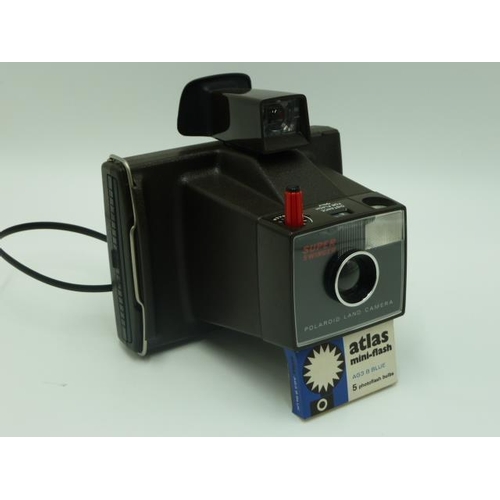 346 - Polaroid super swinger camera in original box complete with flash bulbs and instructions