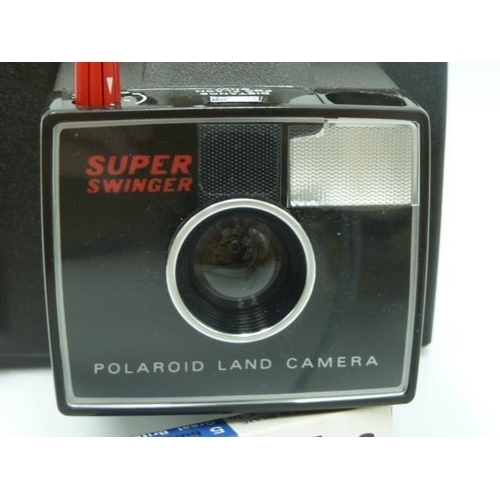 346 - Polaroid super swinger camera in original box complete with flash bulbs and instructions