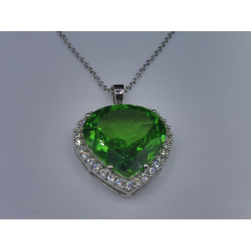 301 - Silver 925 green stone heart shaped pendant on chain in presentation box