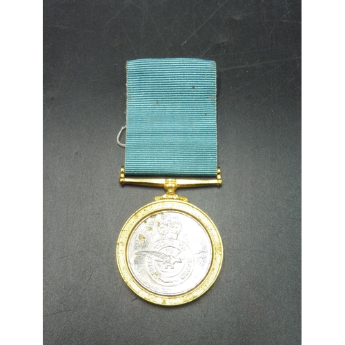 349 - RAF Commemorative Medal and The Hand Book of the Royal Air Force