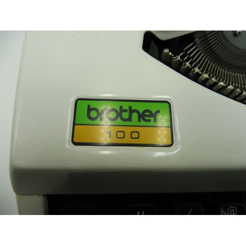 512 - Brother 100 manual Typewriter in carry case