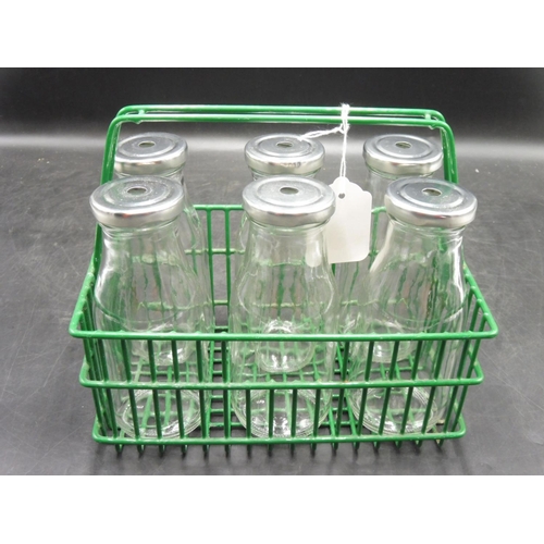 107 - Six Milk bottles with Holed Tops in Green metal Carry Basket