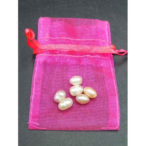 35 - Selection of Six Natural Pearls in Bag