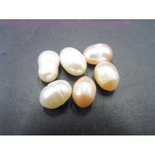 324 - Six Natural Pearls in Gift pouch