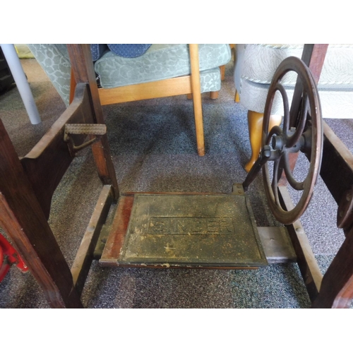 87 - A Jones Treadle Sewing Machine set in Wooden frame