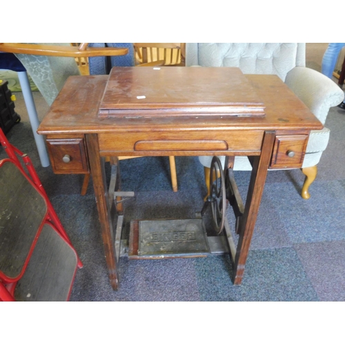 87 - A Jones Treadle Sewing Machine set in Wooden frame