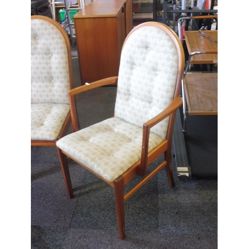 90 - A Teak Extending Dining Table and 6 chairs incl 2 Carvers