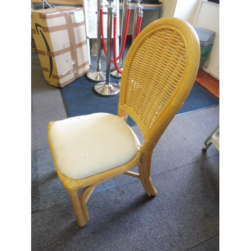 634 - A Nice Octagonal Marble style Dining Table With 4 Upholstered Bamboo Chairs.