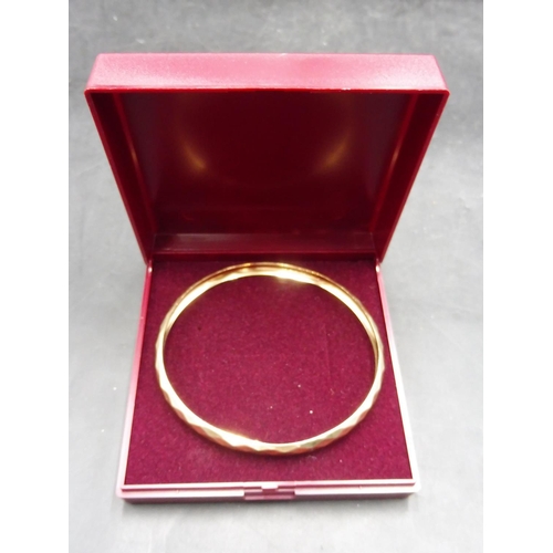 505 - Hallmarked Birmingham 375 Gold Faceted Bangle Complete with Presentation Box (Weight 5.7 grams)