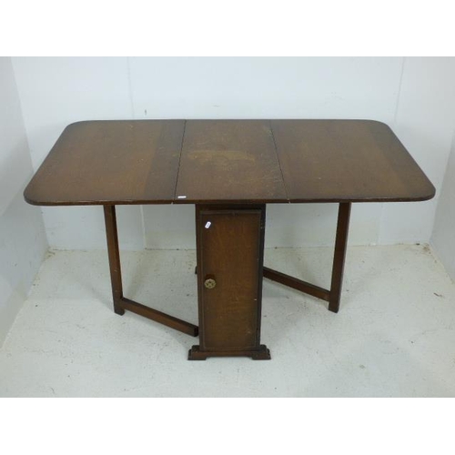 719 - Vintage Drop Leaf Table with Built in Shelf and Door at each end of Table 29.5