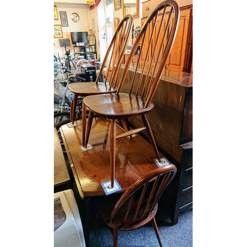 714 - An Ercol Windsor Dining Table and 4 chairs