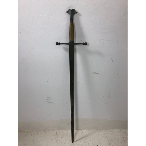 75 - Medieval Style Sword. Wire Bound grip. Demons Heads on The End Of Each Quillon. Overall Length 102cm... 