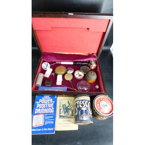 224 - Lidded Lined box of miscellaneous items to include Vintage Triumph Car Badge, Paperweights , Vintage... 