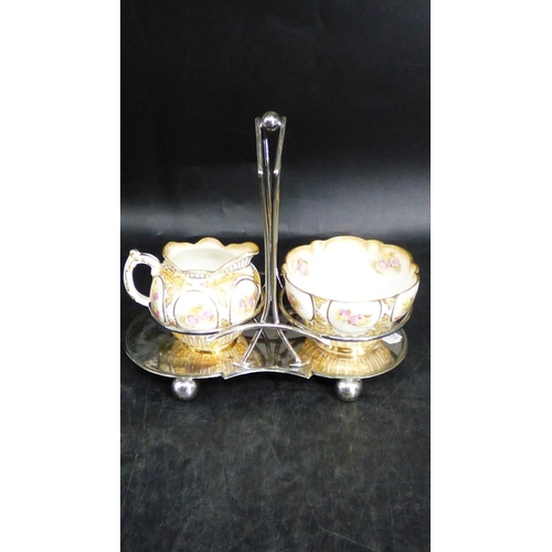 61 - Crescent China milk & sugar Bowl in stand (a/f)